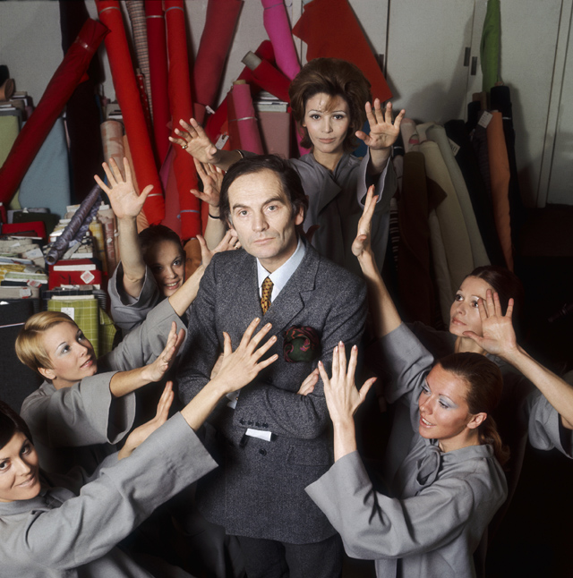 Fashion designer Pierre Cardin stands in his studio surrounded by models. (Photo by Pierre Vauthey/Sygma/Sygma via Getty Images)